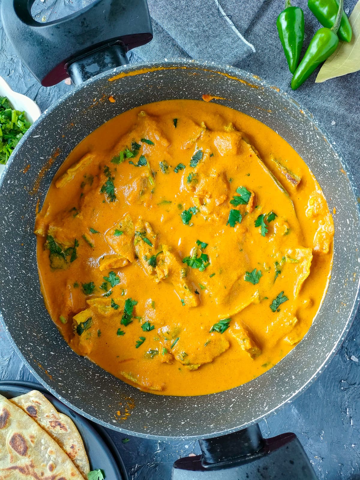 Loaded omelet curry in a pot.