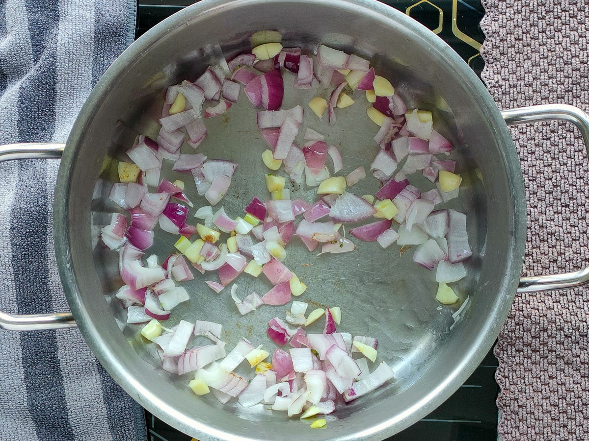 Sauteed onions and garlic in a large pot.