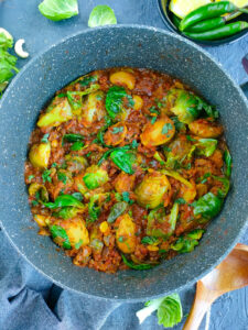 Curried Brussels sprouts in a pot.