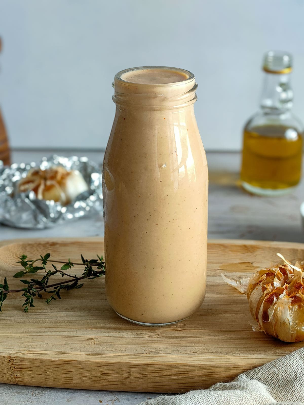 Creamy roasted garlic sauce in a bottle.