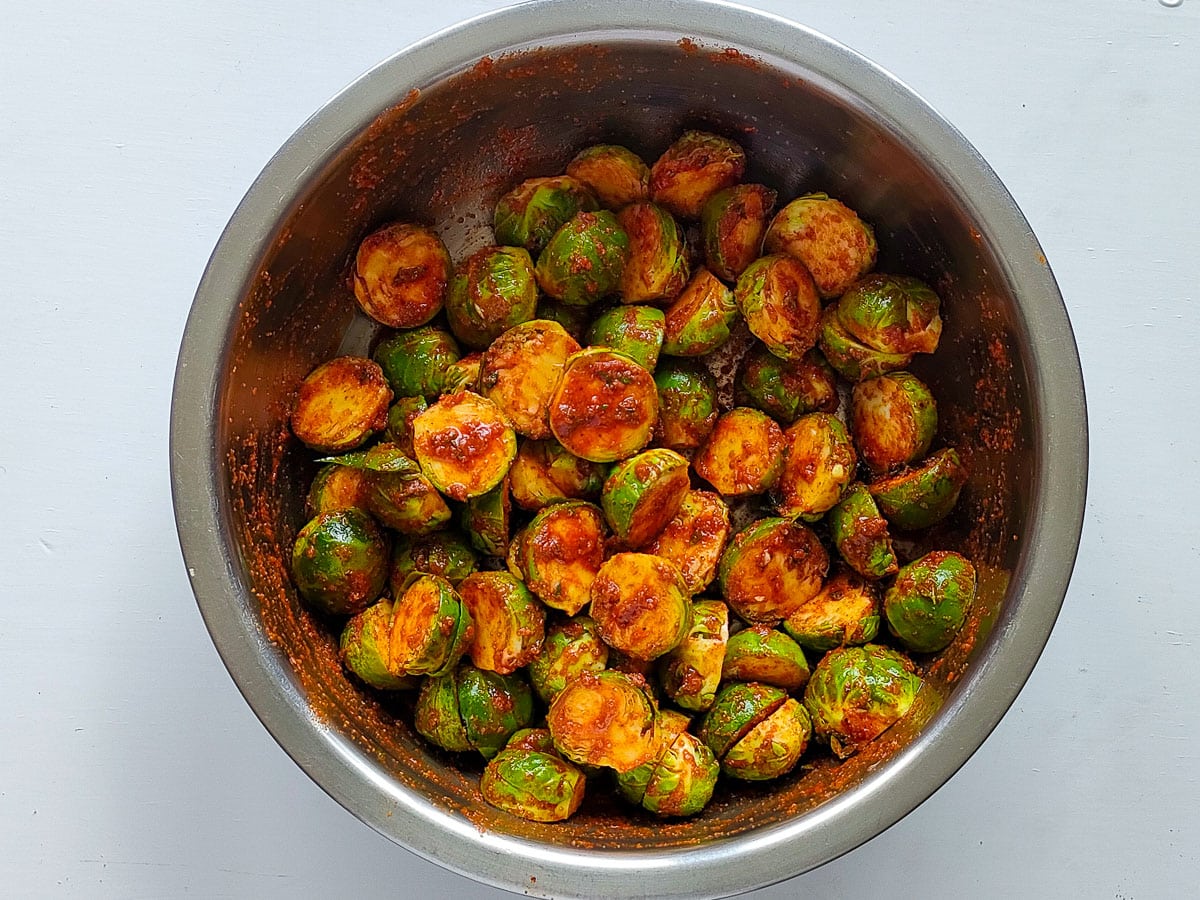 Marinated Brussels sprouts in a large bowl.