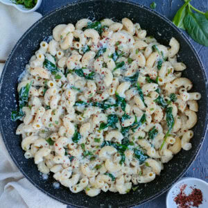 Pasta with silken tofu sauce in a wide pan.
