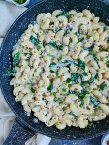 Creamy pasta with silken tofu sauce in a wide pan.