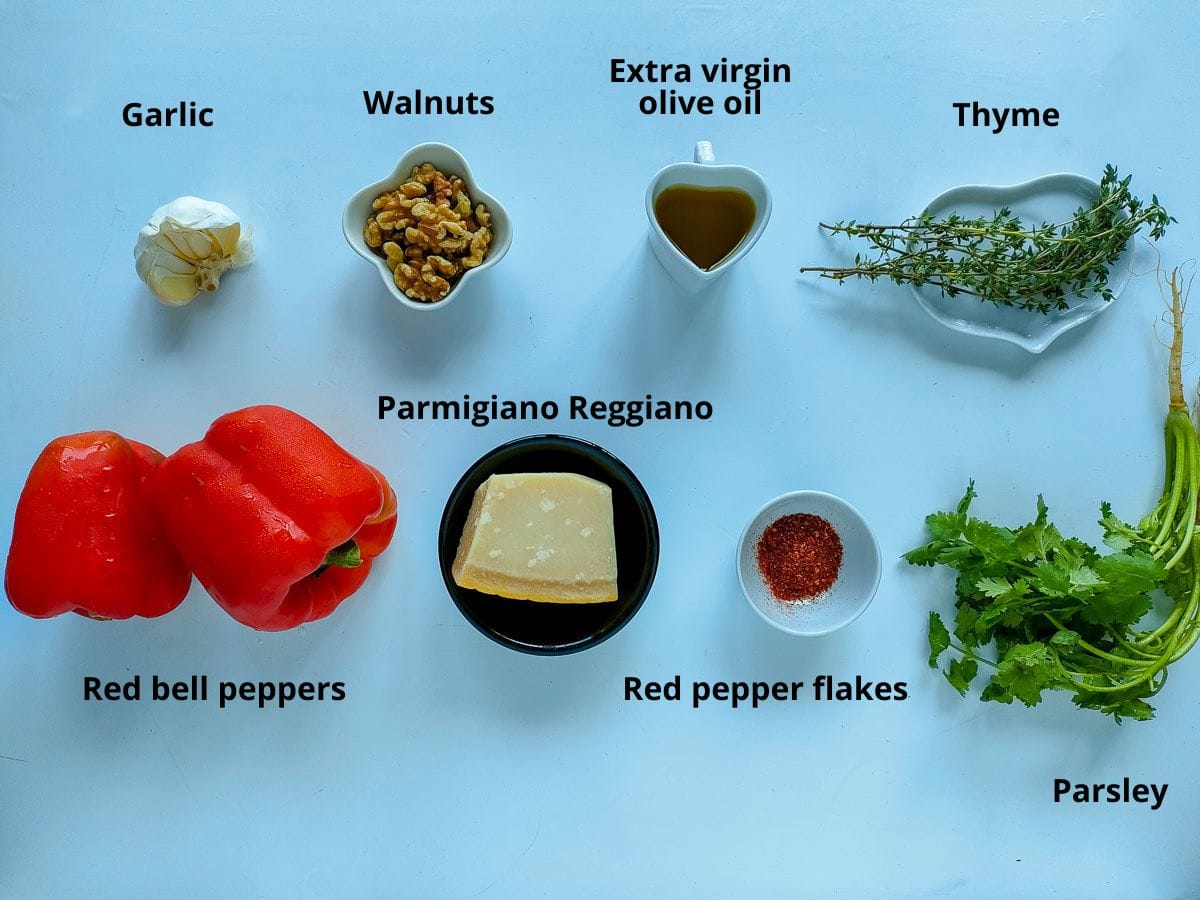 Labelled ingredients for homemade red pepper pesto.