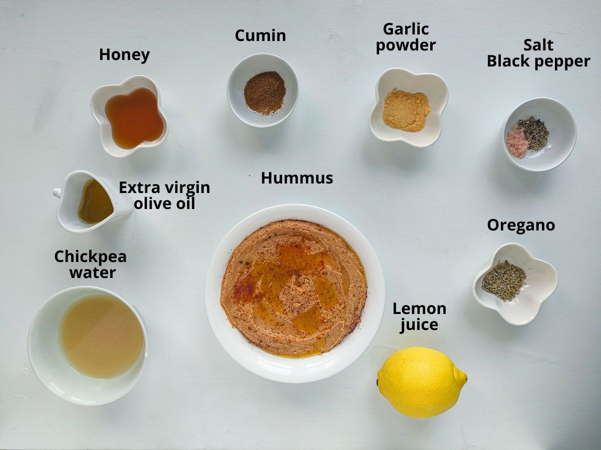 Labelled ingredients to make salad dressing with hummus.