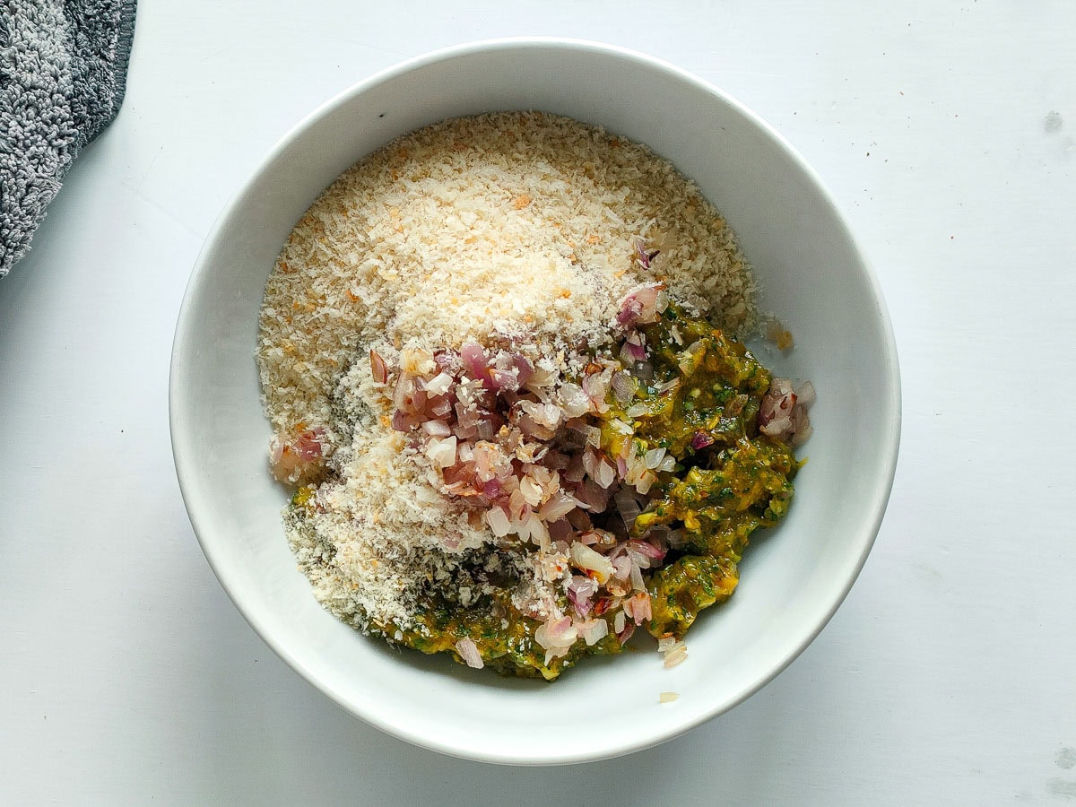 Easy Shrimp Fritters | Prawn Cutlets (no deep frying) Ingredients for prawn fritters with breadcrumbs in a large bowl.