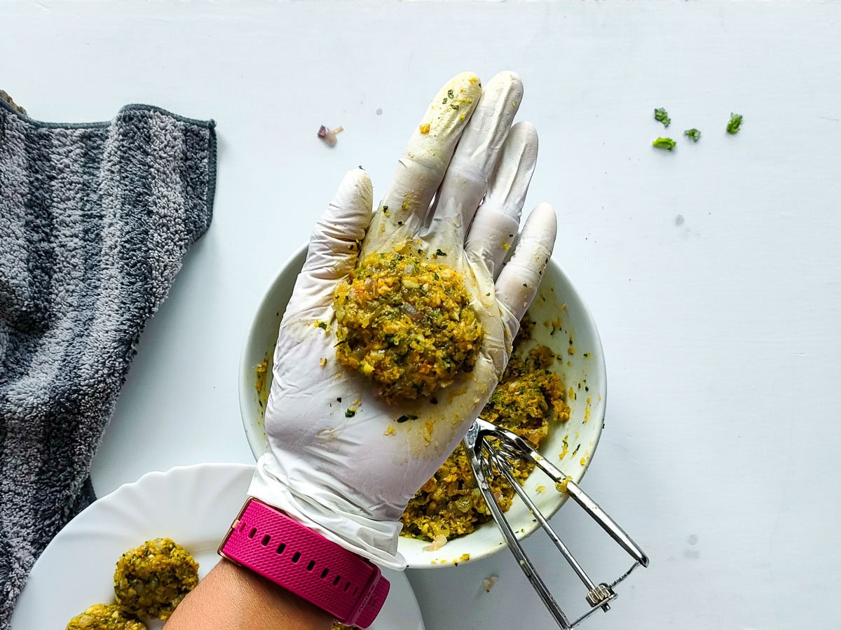 Easy Shrimp Fritters | Prawn Cutlets (no deep frying) Prawn mixture being shaped into a cutlet.