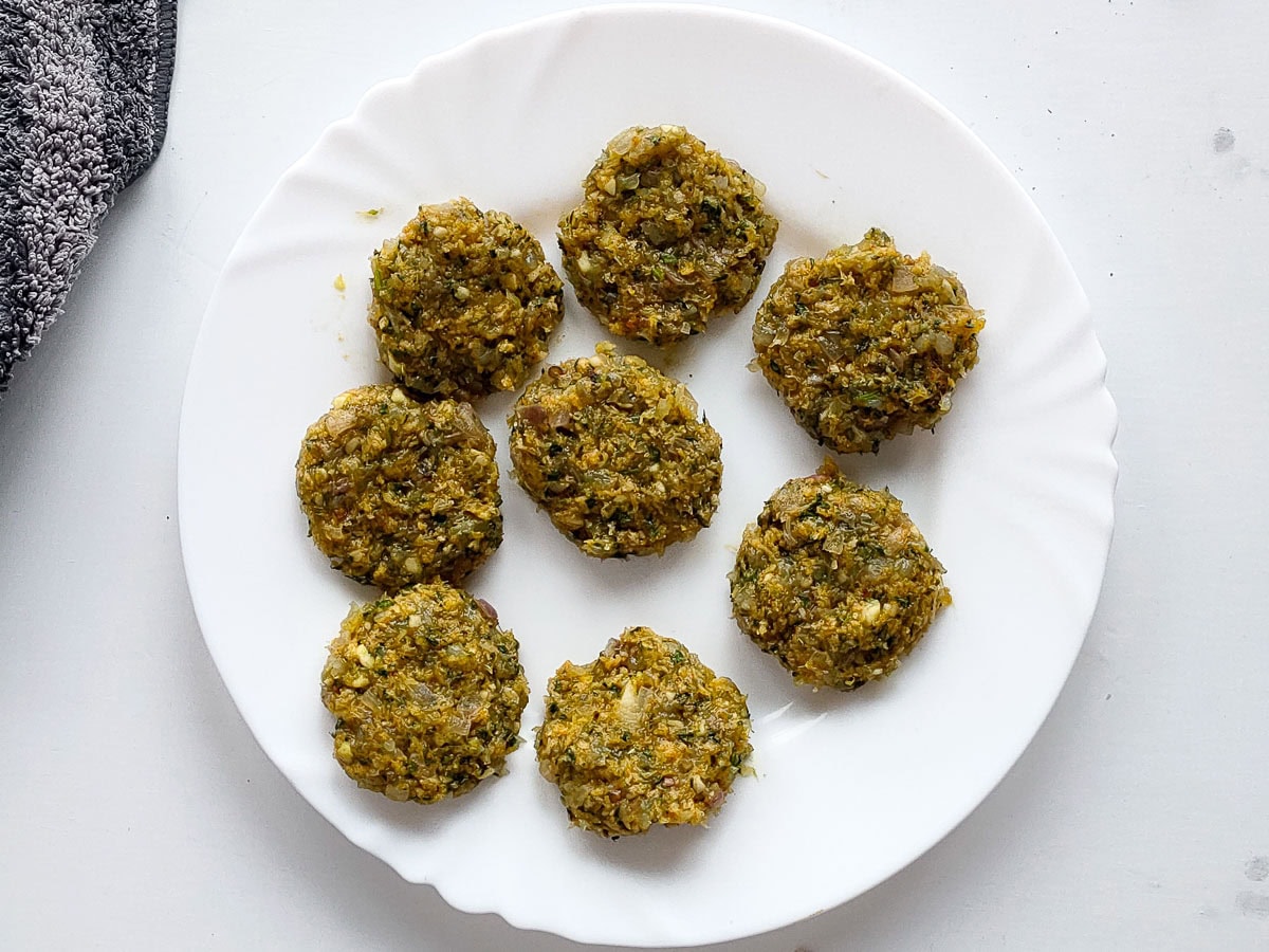 Easy Shrimp Fritters | Prawn Cutlets (no deep frying) Raw prawn cakes shaped into patties and ready to be cooked.