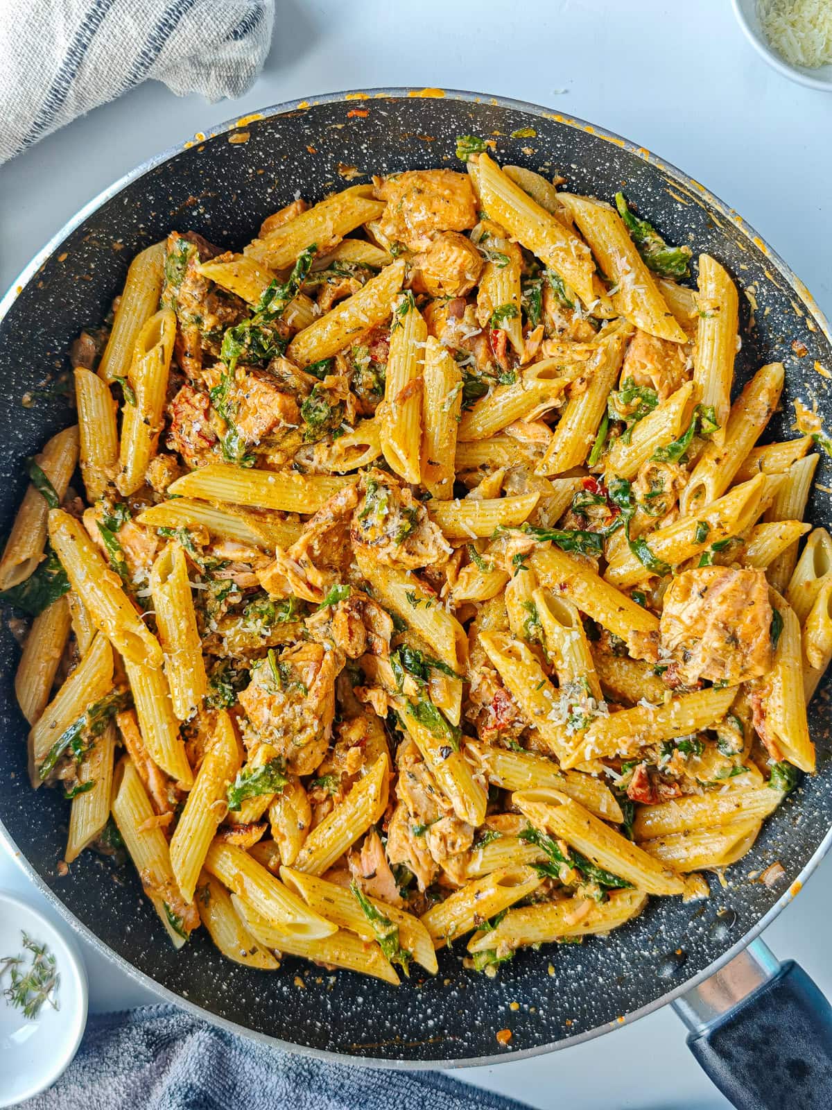 Cajun Pasta with Salmon (without cream) Creamy Cajun salmon pasta in a large pan.