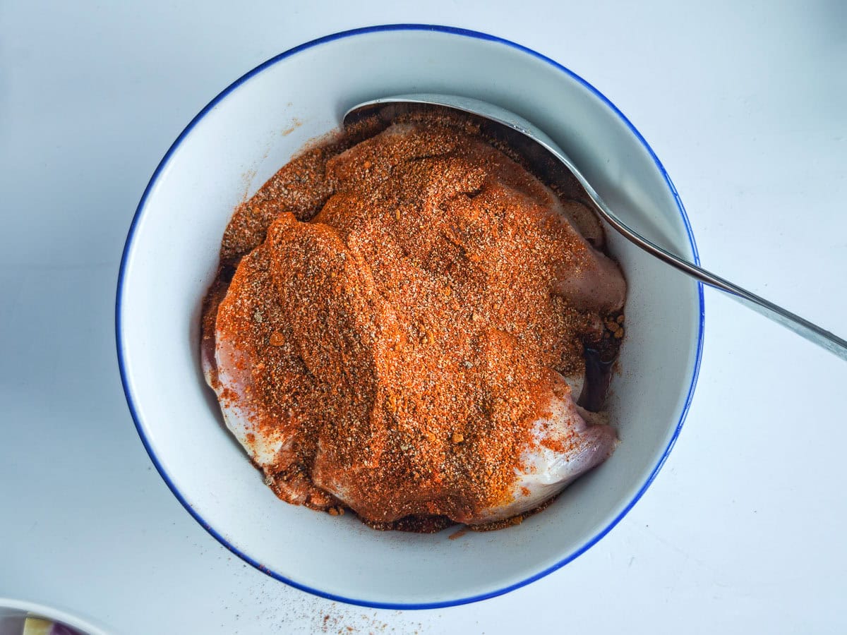 Mediterranean Chicken Shawarma Plate Chicken with shawarma spices in a bowl.
