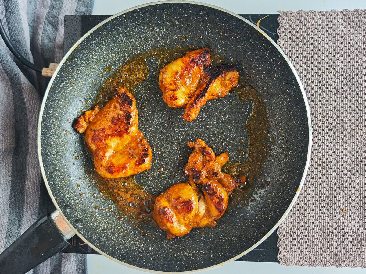 Mediterranean Chicken Shawarma Plate Seared chicken for shawarma platter on a frying pan.