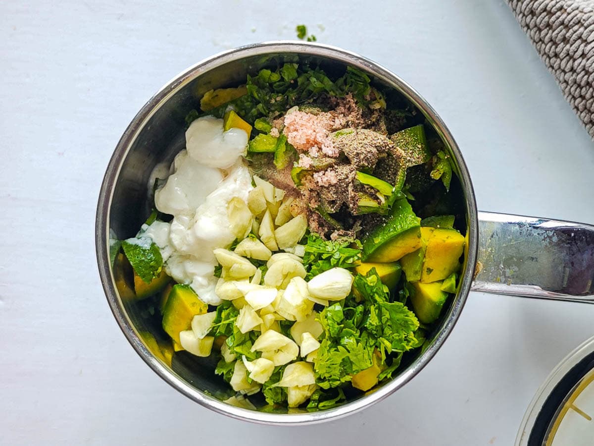 Easy Avocado Crema with Greek Yogurt Ingredients for no-cream avocado cream sauce in a blender jar.