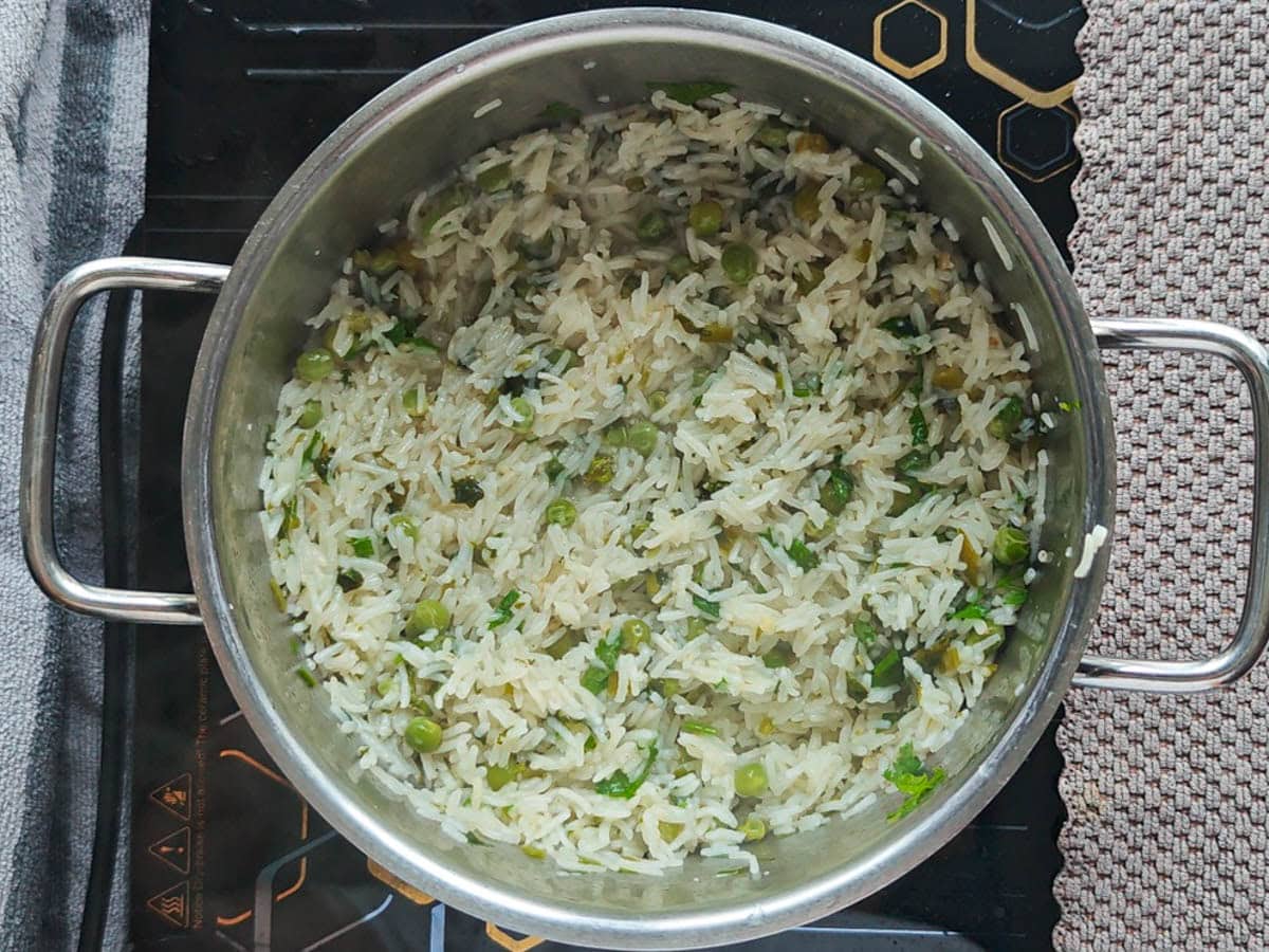 Easy One Pot Cilantro Lime Basmati Rice Basmati rice with cilantro in a large pot.