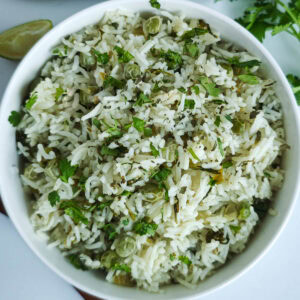 Easy One Pot Cilantro Lime Basmati Rice Cilantro lime basmati rice in a white bowl.