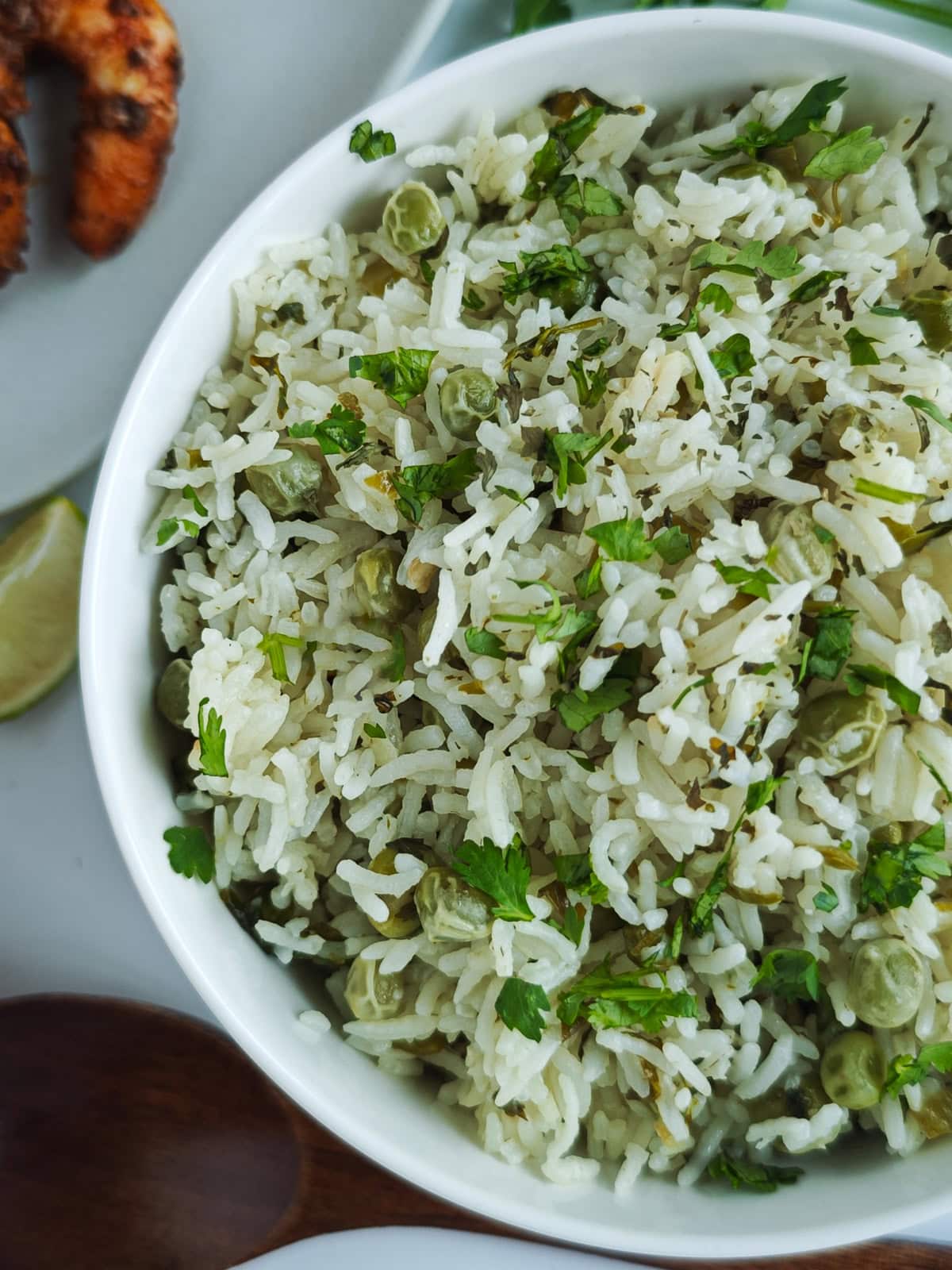 Easy One Pot Cilantro Lime Basmati Rice Cilantro lime Basmati rice in a white bowl.
