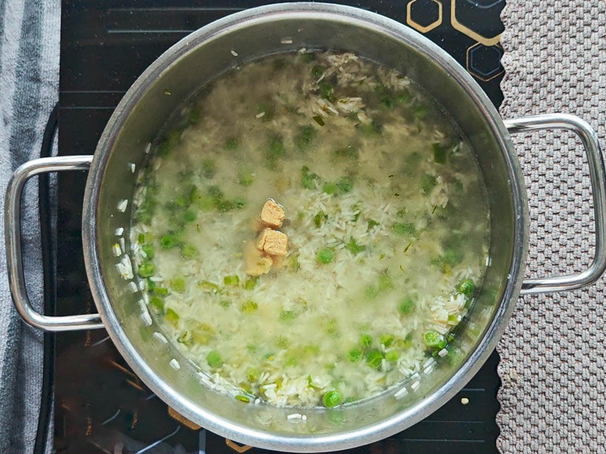 Easy One Pot Cilantro Lime Basmati Rice Basmati rice with water and bouillon cube in a pot.