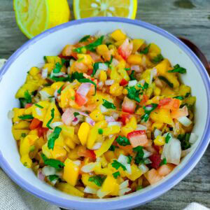 Mango Jalapeño Salsa with Tomatoes Mango jalapeno salsa with tomatoes in a bowl.