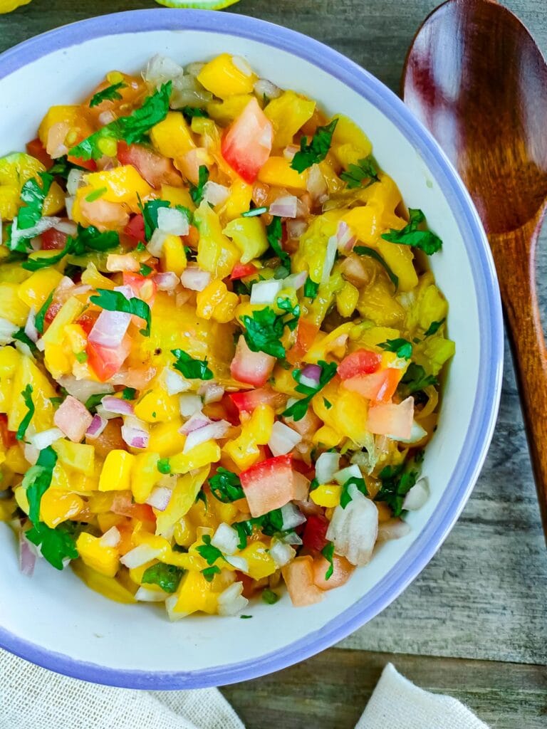 Spicy mango salsa with jalapenos in a bowl.