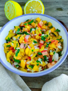 Mango JalapeƱo Salsa with Tomatoes Mango jalapeno salsa in a bowl.
