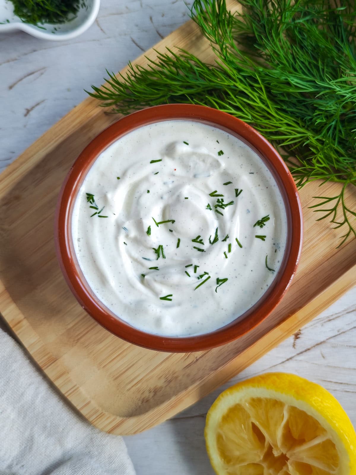 Easy Garlic Yogurt Sauce (with Roasted Garlic) Garlic sauce with Greek yogurt in a bowl.