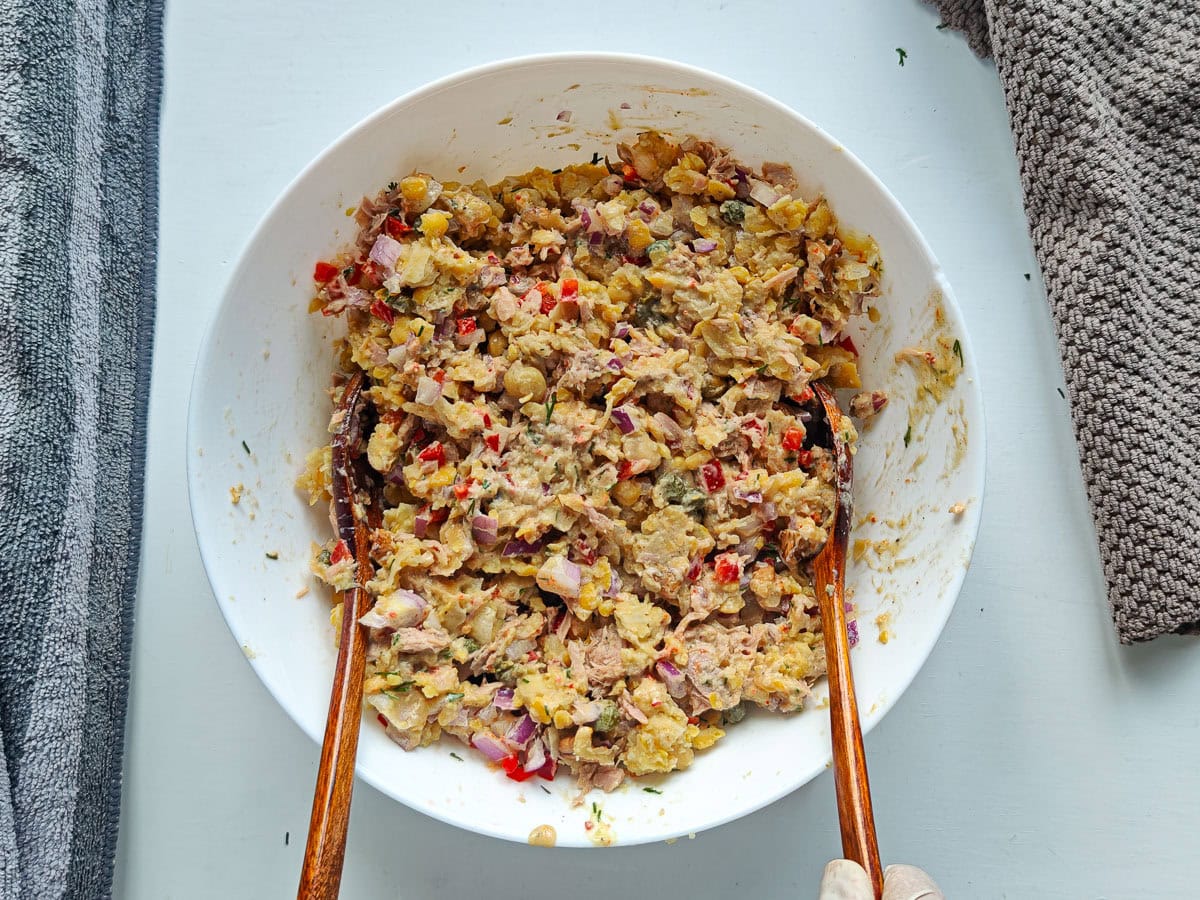 Mediterranean Chickpea Tuna Salad (No Mayo, High Protein) Tuna and chickpeas mixed with Greek yogurt dressing in a large bowl.