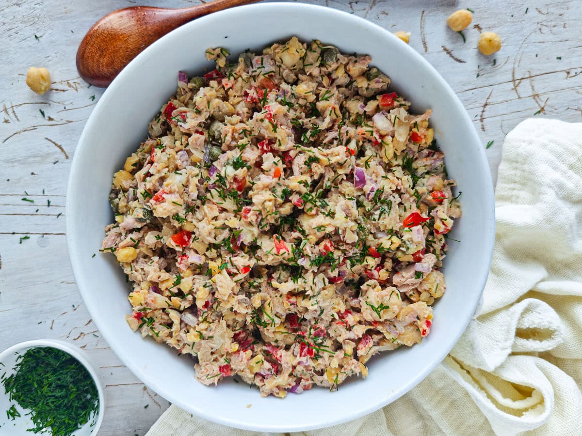 Mediterranean Chickpea Tuna Salad (No Mayo, High Protein) High-protein chickpea salad with tuna in a large white bowl.