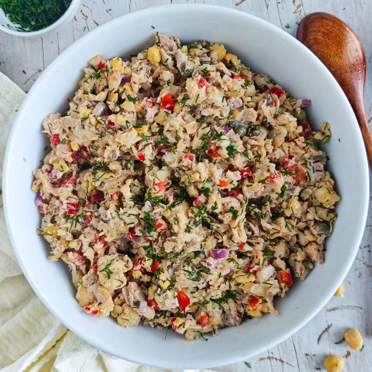 Mediterranean Chickpea Tuna Salad (No Mayo, High Protein) Chickpea salad with tuna in a large white bowl.