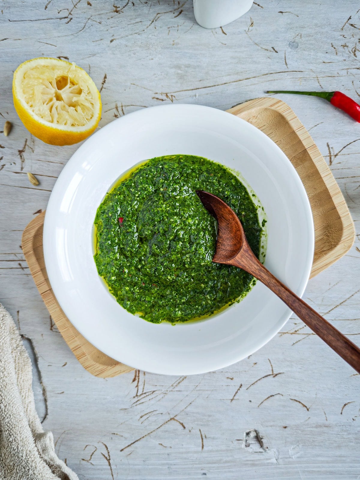 Chimichurri sauce with basil in a deep plate.