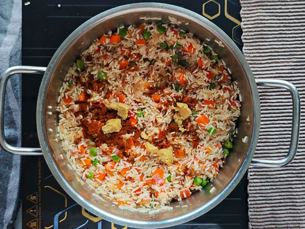Easy Chimichurri Rice with Vegetables Rice with vegetables and paprika in a pot.