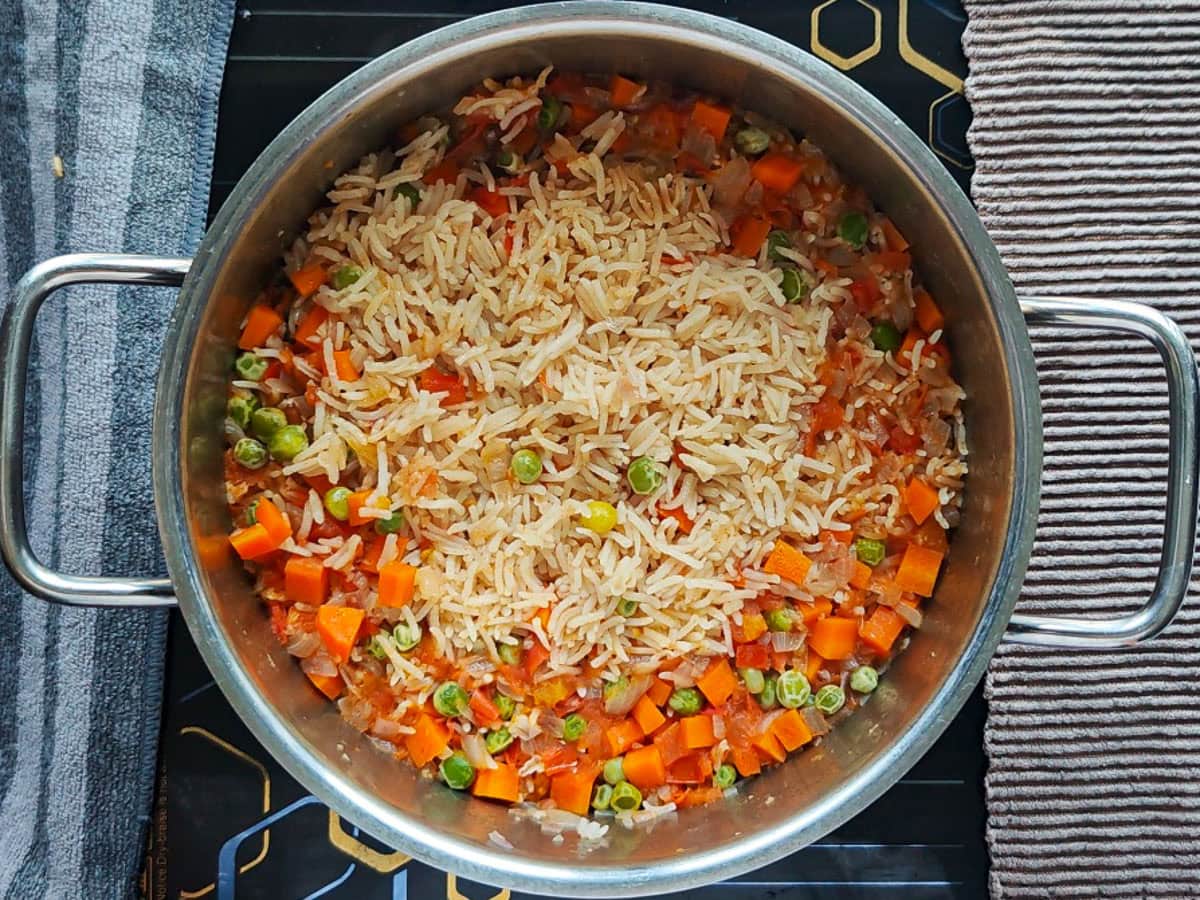 Easy Chimichurri Rice with Vegetables Cooked basmati rice and veggies in a pot.