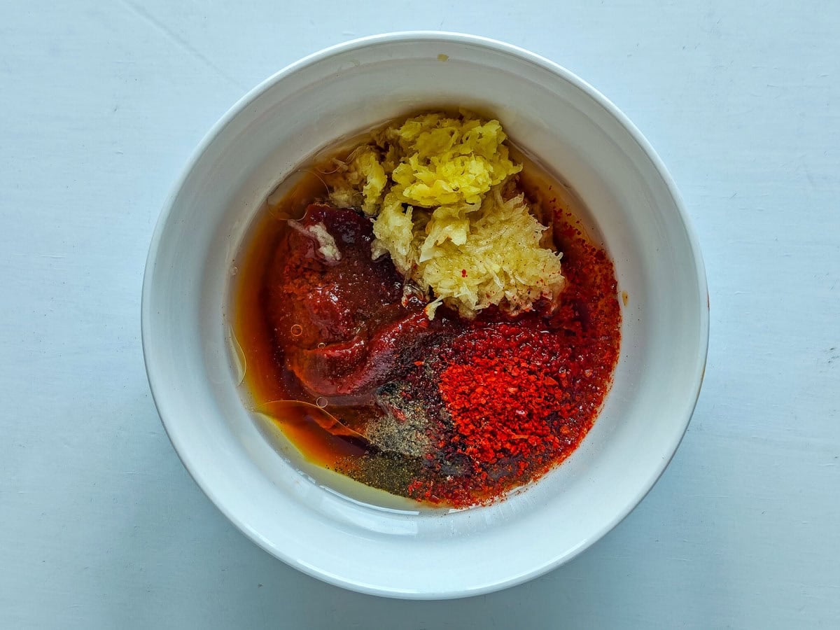 Easy Gochujang Chicken Thighs (Sticky & Oven-Baked) Ingredients for gochujang marinade in a small bowl.