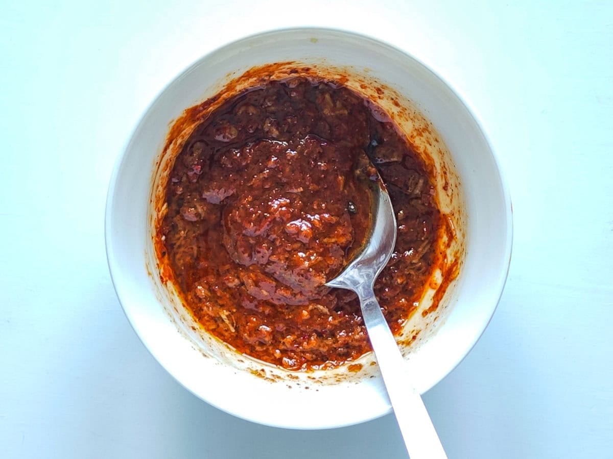 Easy Gochujang Chicken Thighs (Sticky & Oven-Baked) Gochujang marinade for chicken in a small bowl.